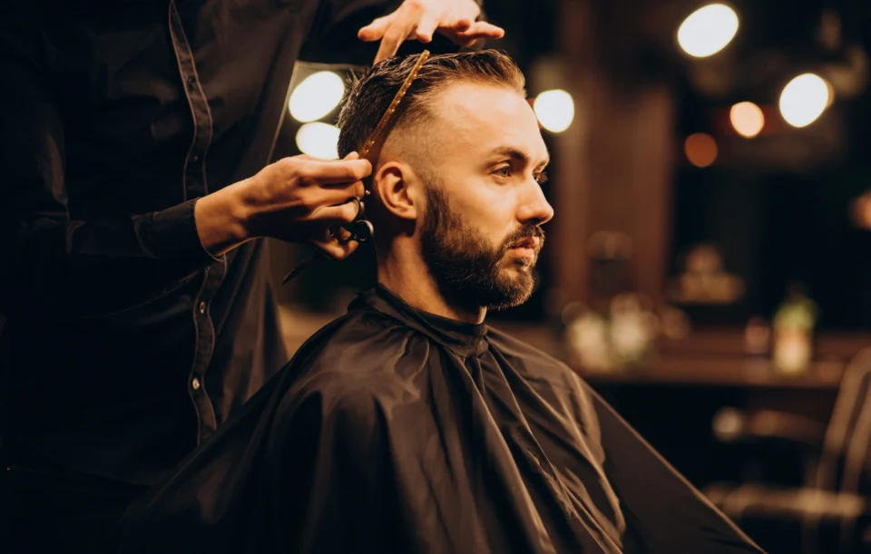 young-man-barbershop-trimming-hair-scaled